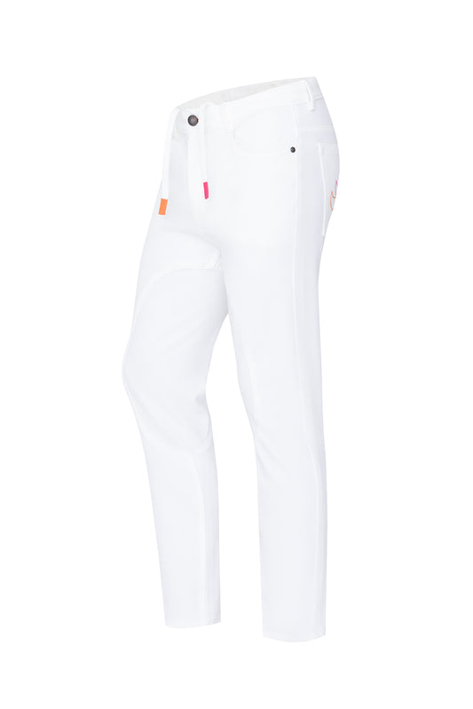 A pair of white close contact jeans with a slim fit, five pockets, and a button fly. The jeans feature small orange detailing on the buttons and a drawstring waist with silicone grip technology.